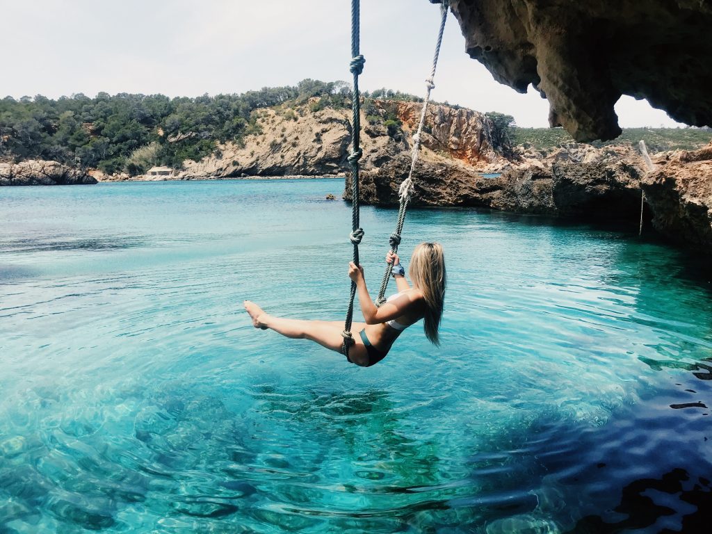 What is the locals' favorite pastime in Ibiza?