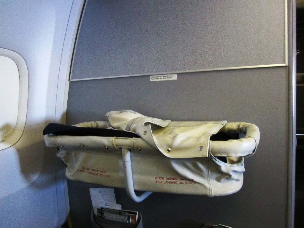 Having a bassinet during the flight is priceless - Air Travel With an Infant