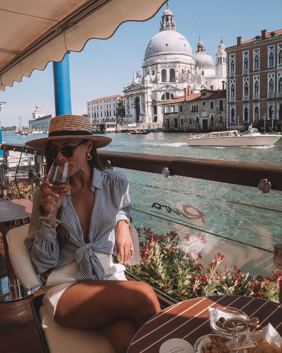 A glass of your favourite bubbles served al fresco with iconic views over the Grand Canal