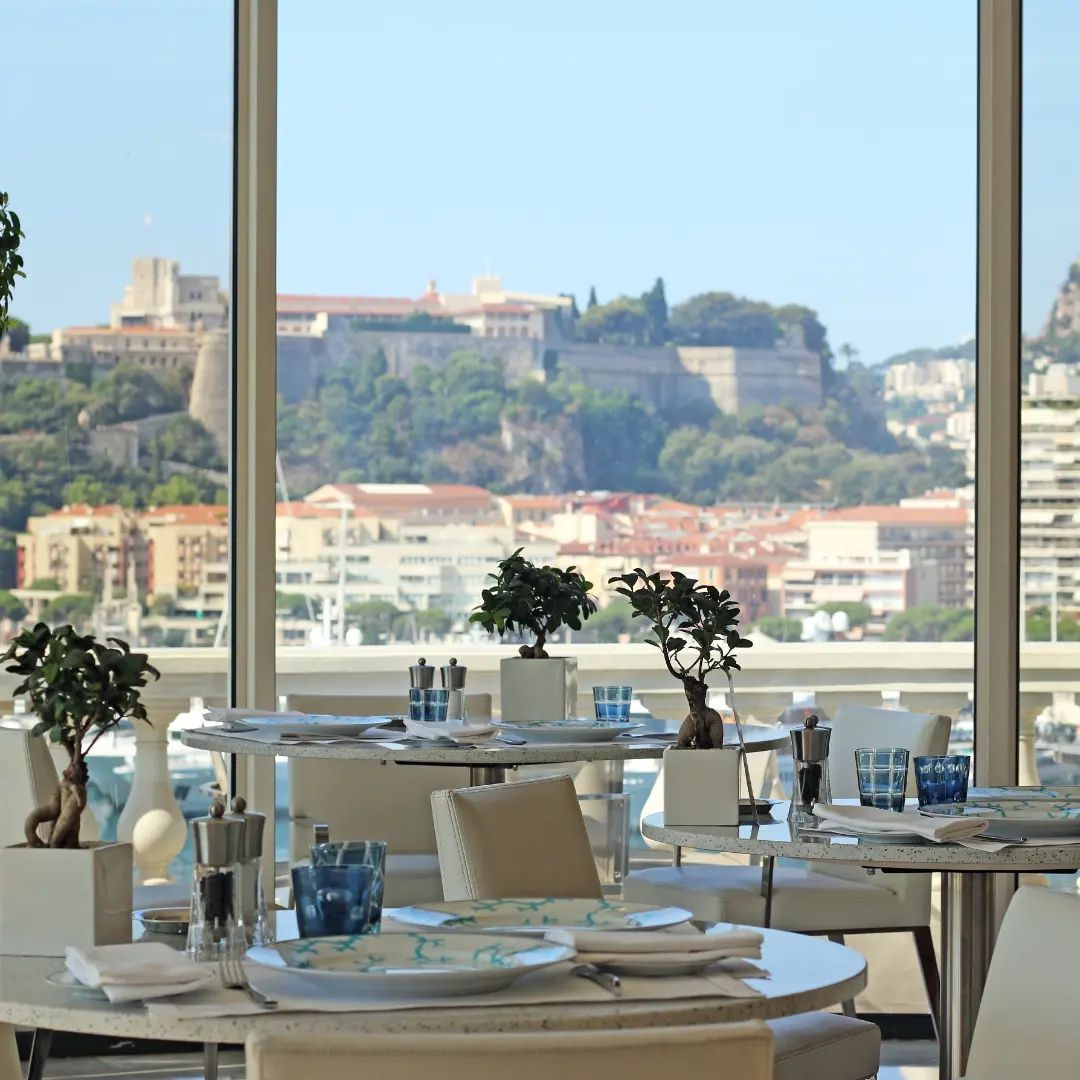 Enjoying a Mediterranean-inspired lunch on the terrace while admiring the port of Monaco and the Rock