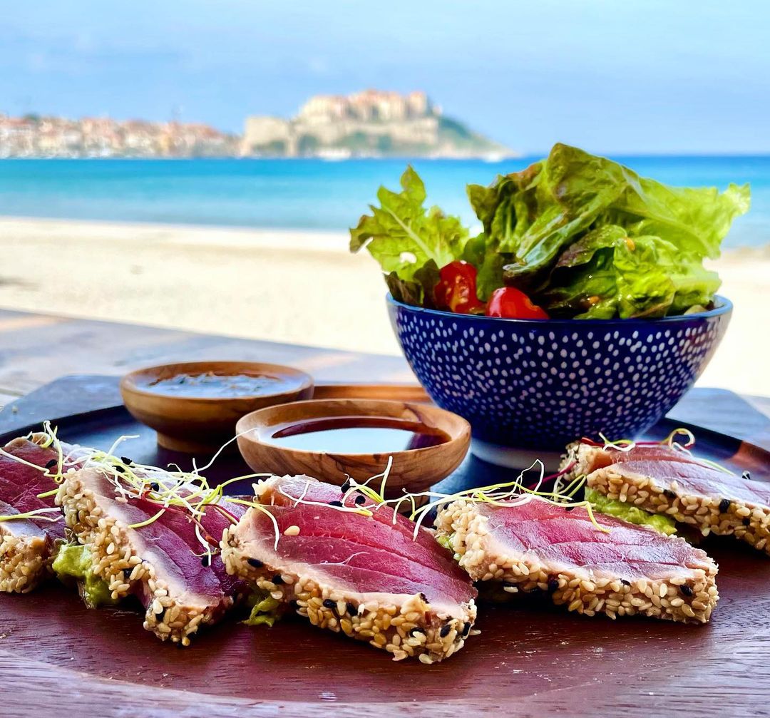 Fresh Sashimi with amazing sea view at Octopussy - Best Beach Clubs and Bars in Corsica