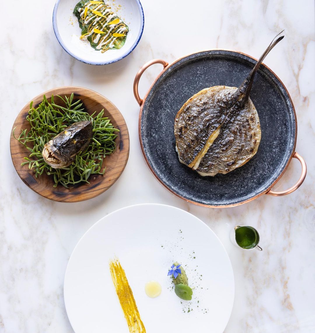 Grilled locally-caught fish and oysters from Maison Giol by chef Emmanuel Pilon for the 3-Michelin-star Le Louis XV - Alain Ducasse