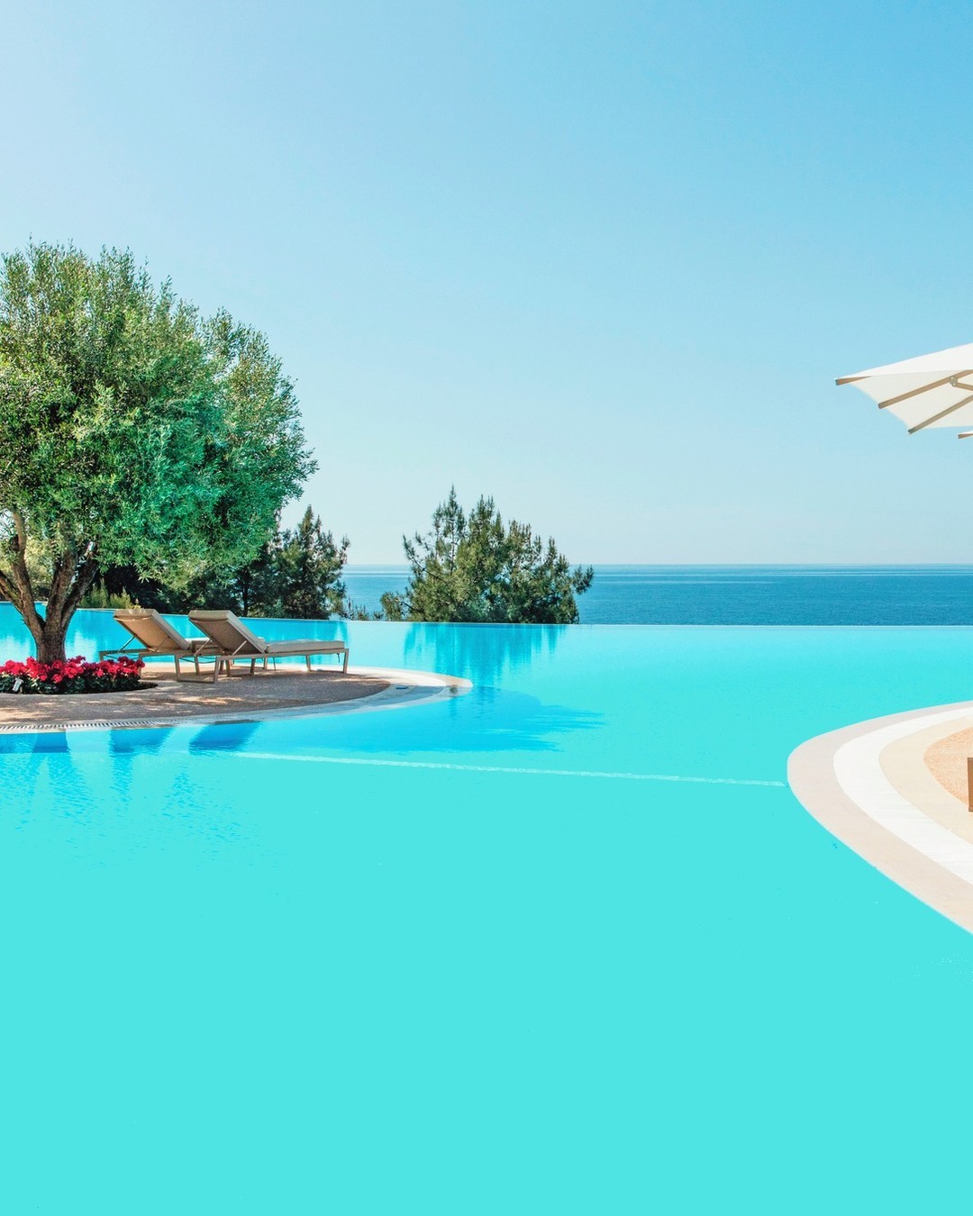 Enjoy the 350 metres of the unspoilt Blue Flag beach or the glistening infinity pool at Ikos Oceania