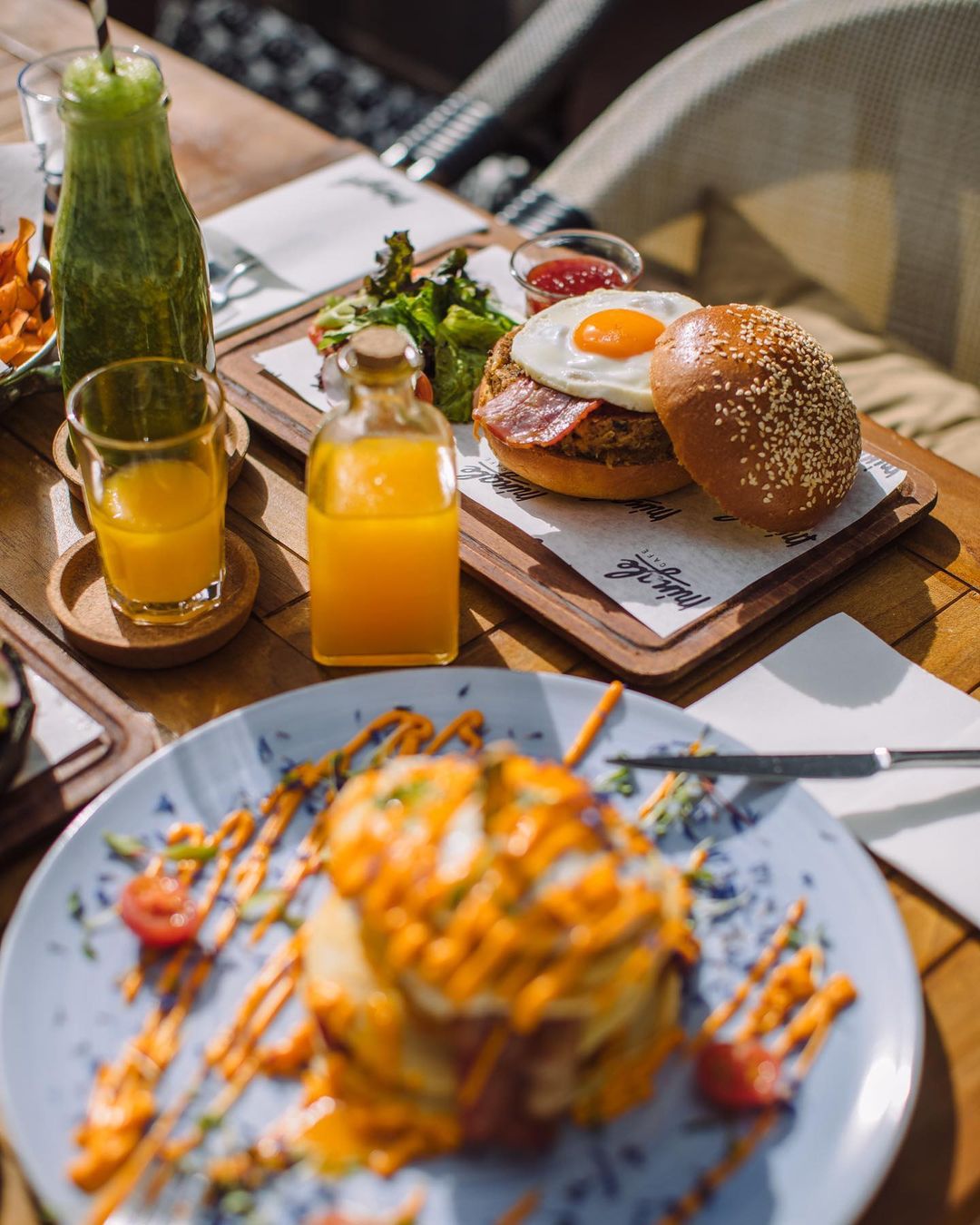 Irezistible brunch with burger, potatoes and orange juice at Mingle Cafe - Best Restaurants in Cyprus