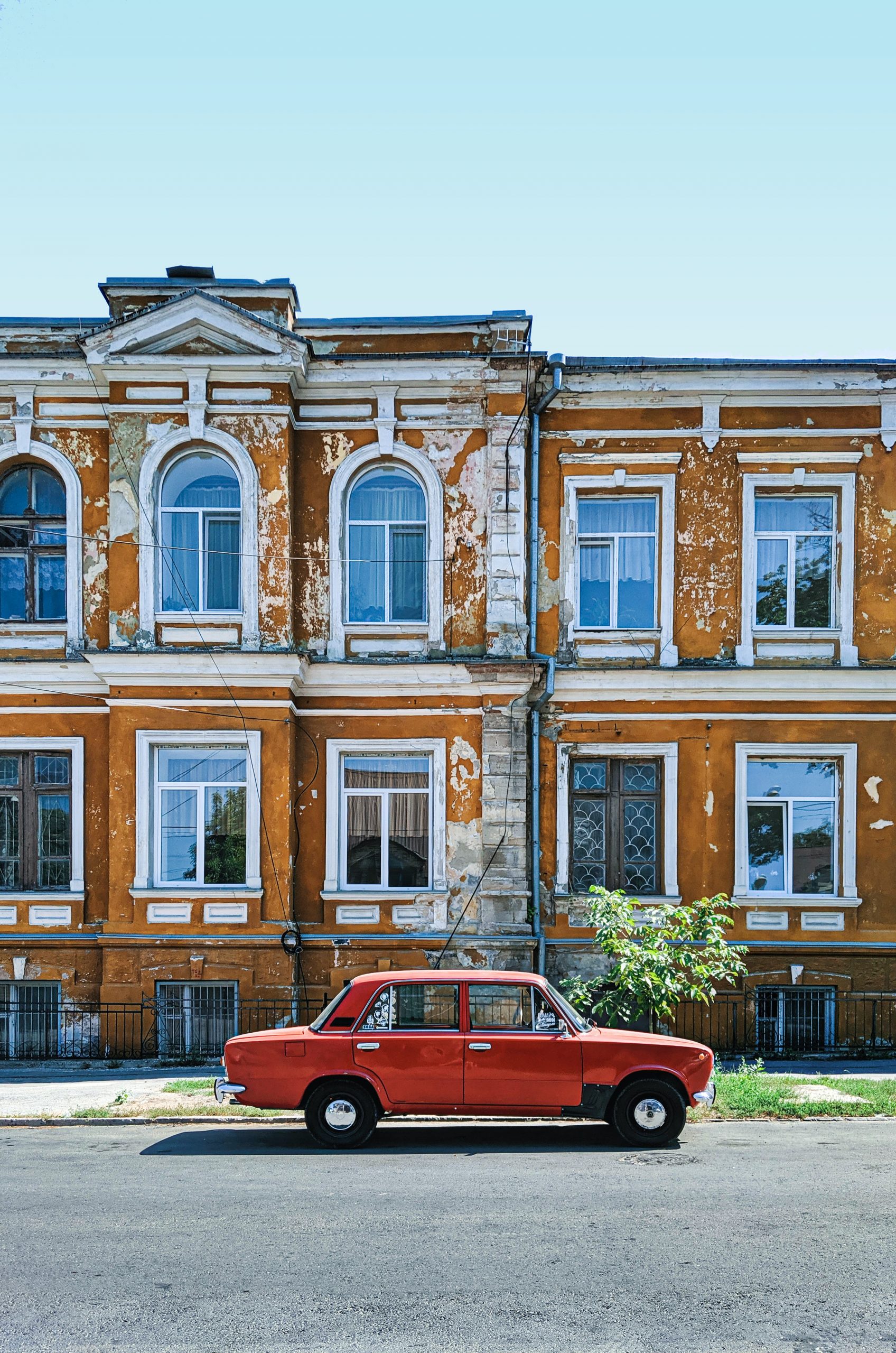 A vintage Soviet 'vaz Zhiguli' car painted in red color in the city of Chișinău, Moldova